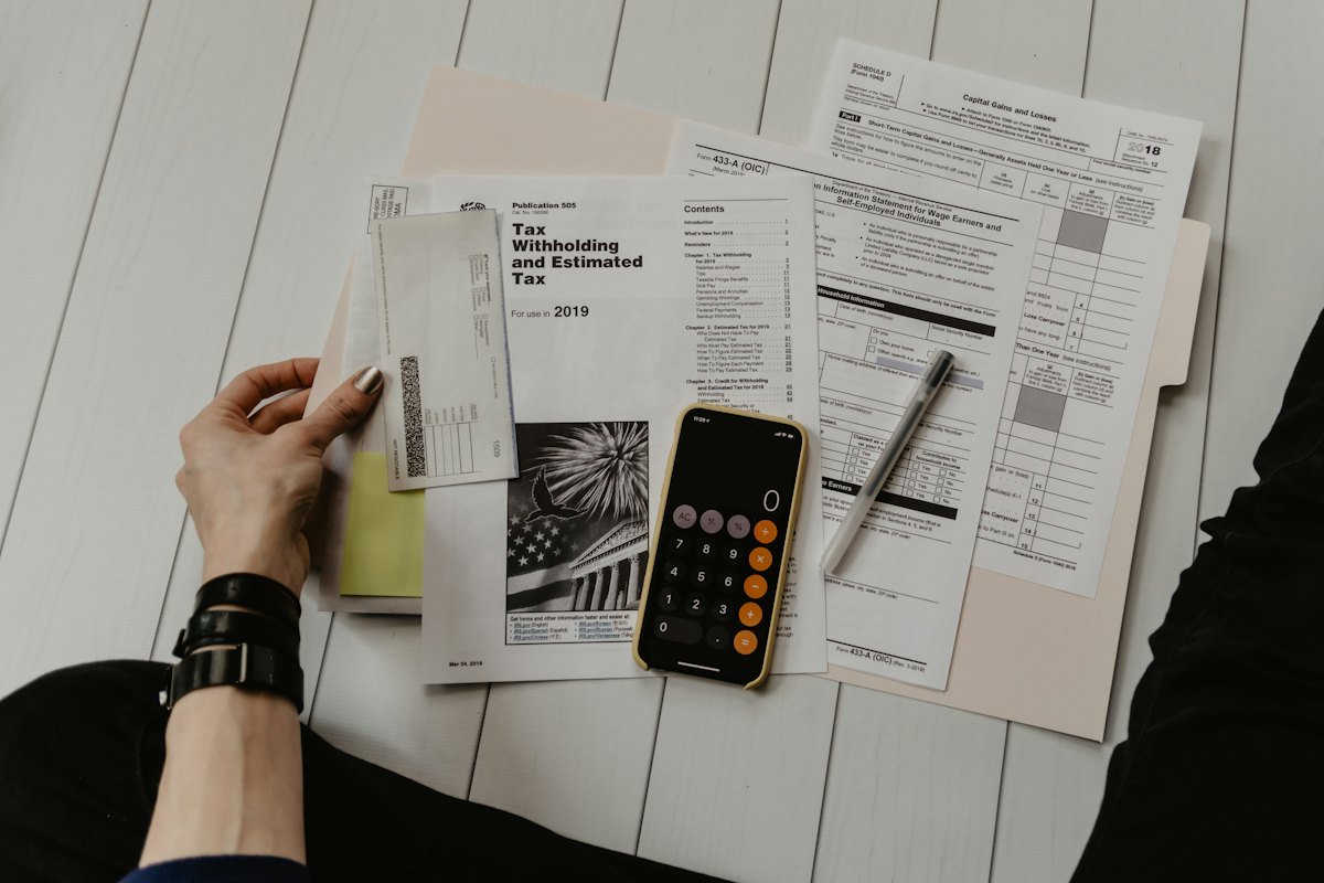 Business owner reviewing funding paperwork and figures